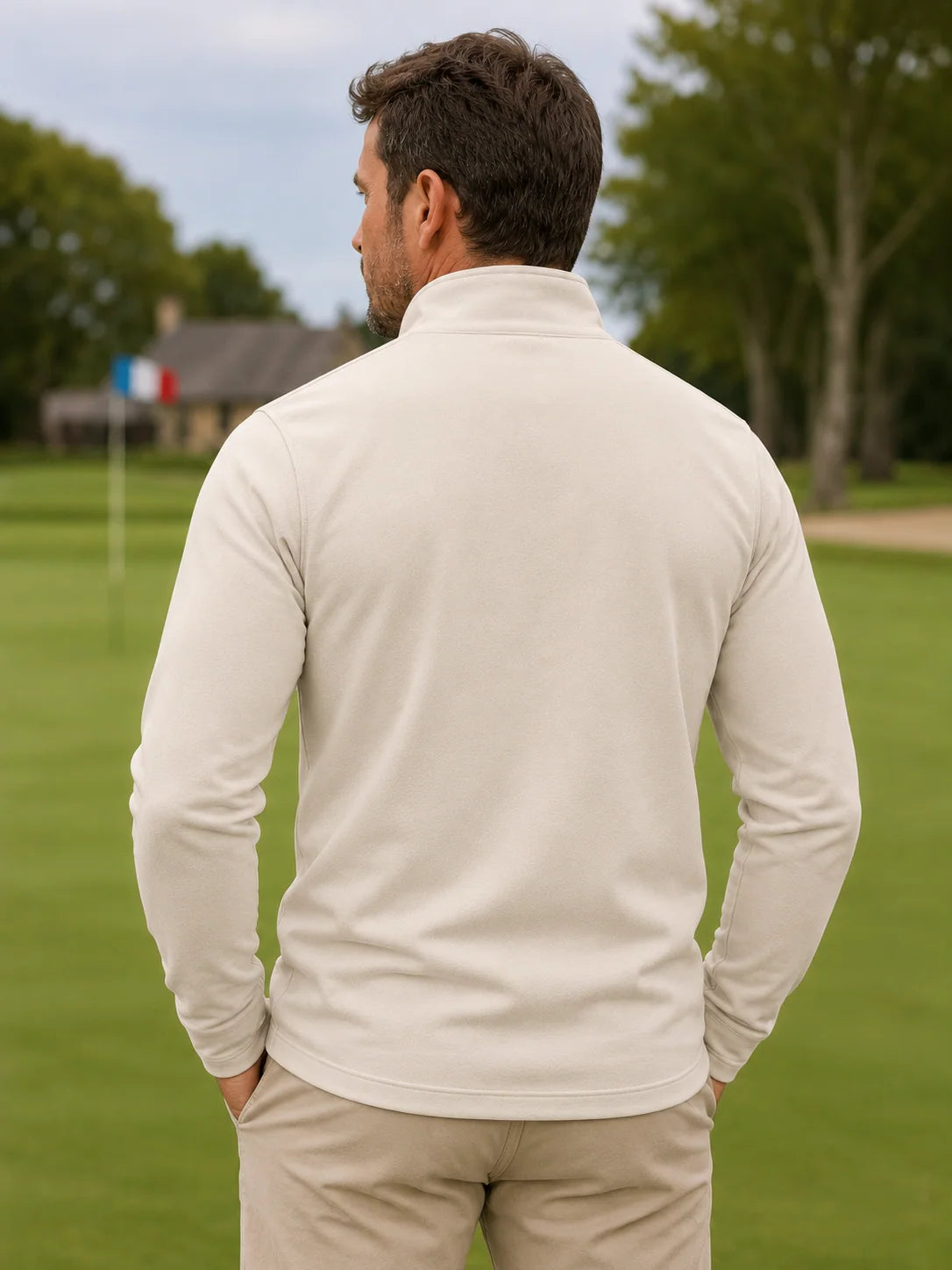 Cremebeiger Golf-Pullover mit strukturierter Oberfläche und Viertelreißverschluss aus Funktionsmaterial