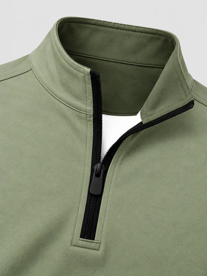Salbeigrüner Golf-Pullover mit strukturierter Oberfläche und Viertelreißverschluss aus Funktionsmaterial