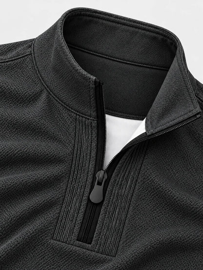 Golf-Pullover aus Funktionsmaterial in Anthrazitgrau mit feiner Mikrorippstruktur und Viertelreißverschluss