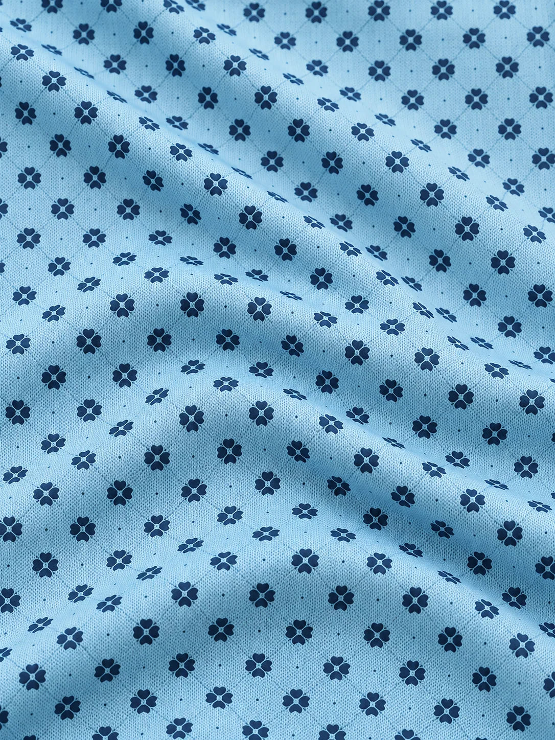 Performance-Golfpullover in Himmelblau mit Blumenmuster und Viertelreißverschluss