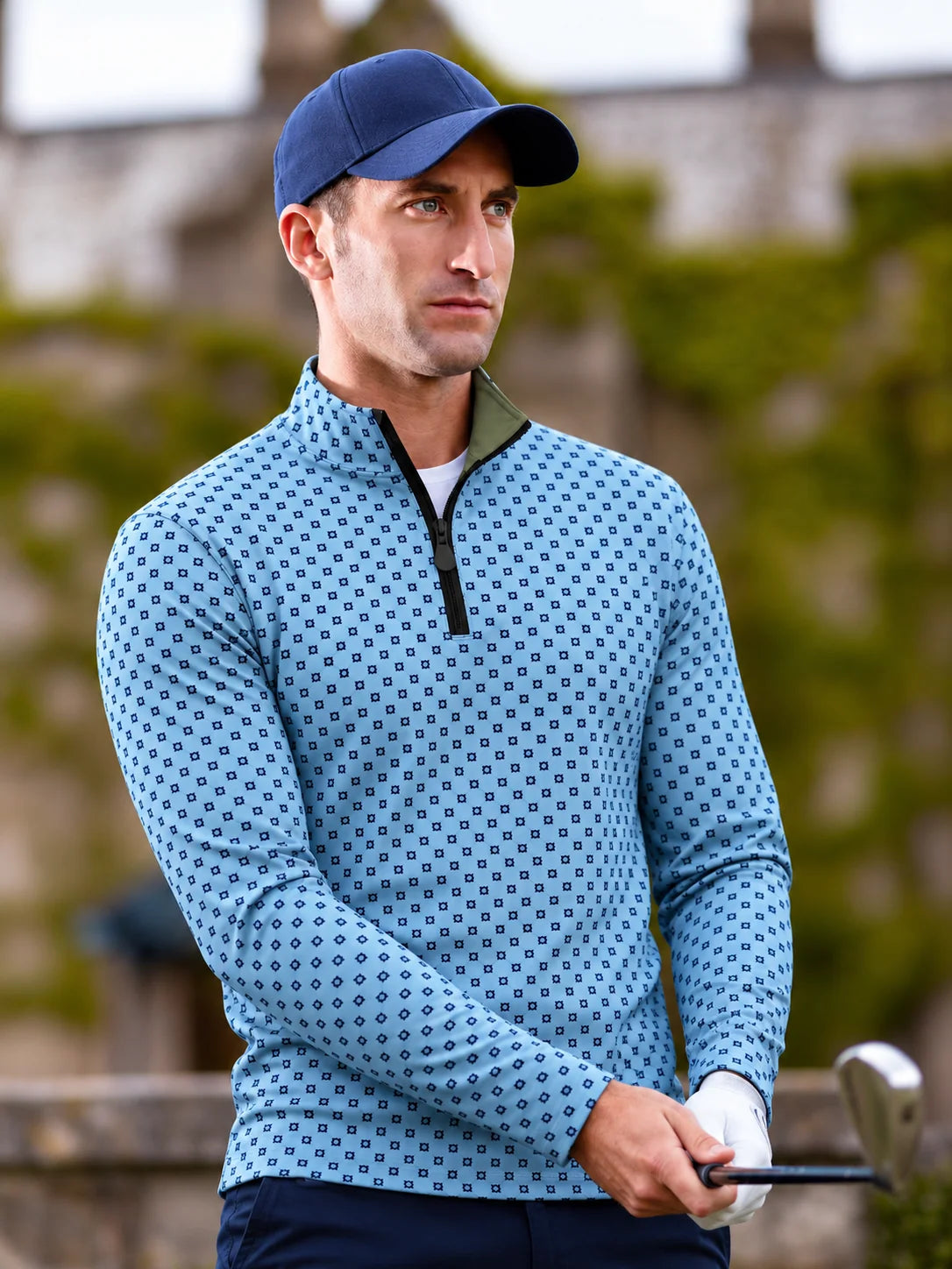 Performance-Golfpullover in Himmelblau mit Blumenmuster und Viertelreißverschluss